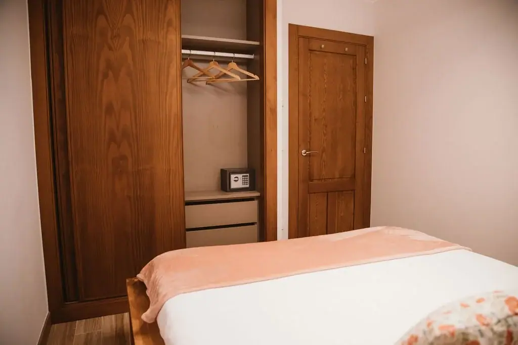 Bedroom with a built-in wardrobe in a Standard apartment