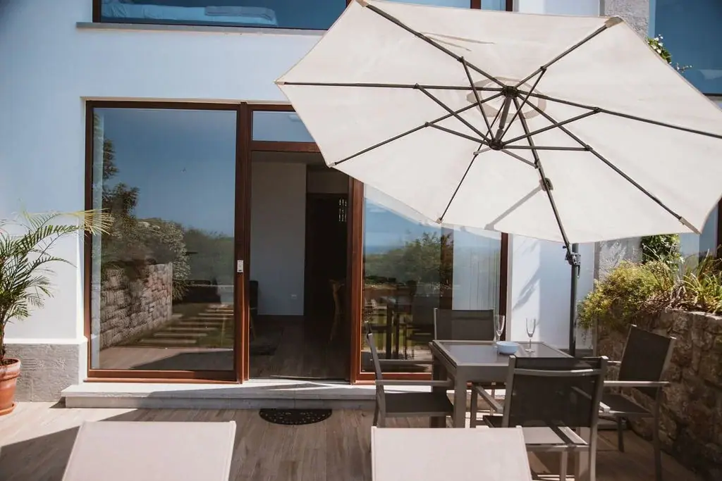 Terrace with a parasol at a Standard apartment