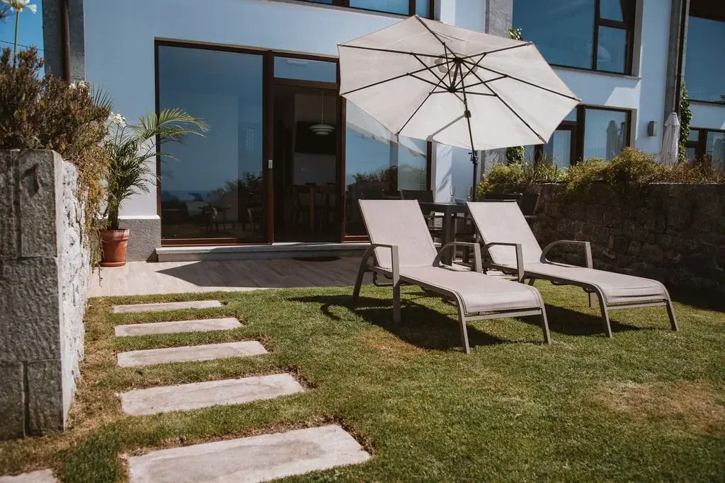 Sun loungers in the private garden of a Standard apartment