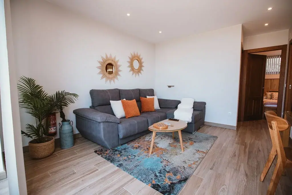 Living room with a large window in a Standard apartment