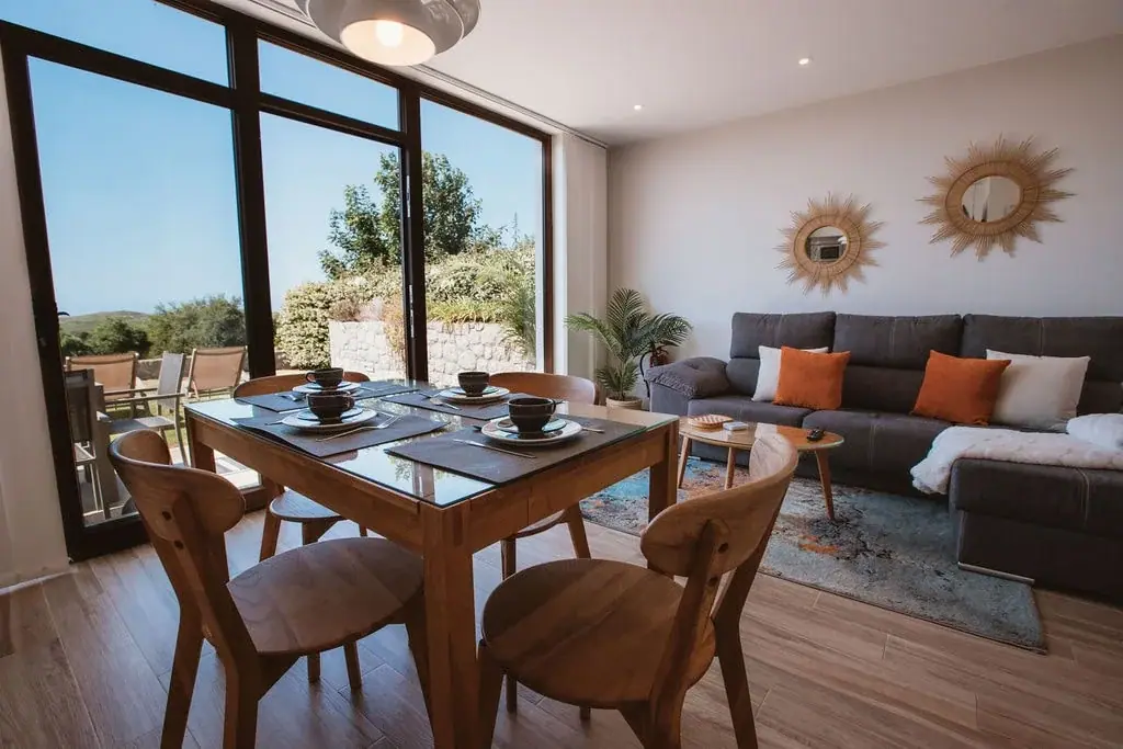 Dining and living room of a Standard apartment with views over the fields