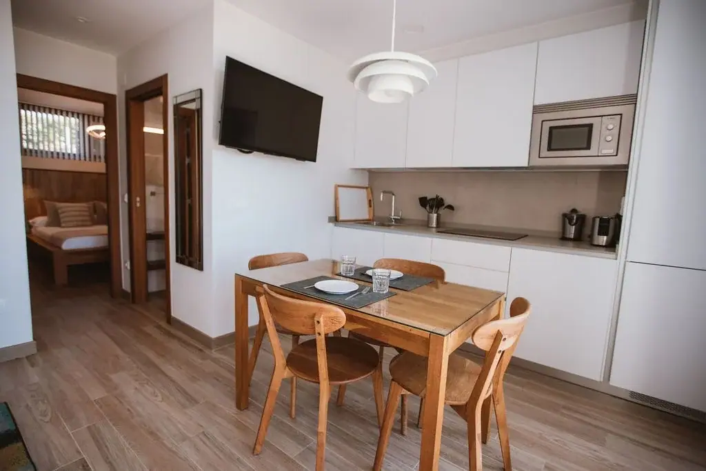 Equipped kitchen and dining table in a Standard apartment
