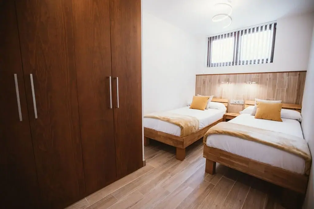 Twin bedroom with a wardrobe in a Standard apartment