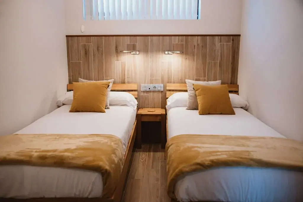 Twin bedroom with two single beds in a Standard apartment