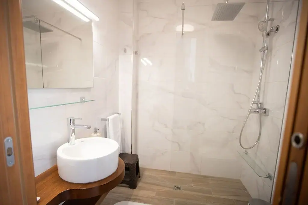 Bathroom of a Standard apartment with a washbasin and shower