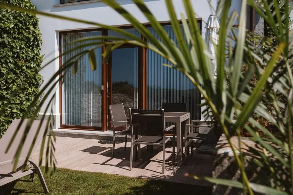 Terrace with a table at a Standard apartment