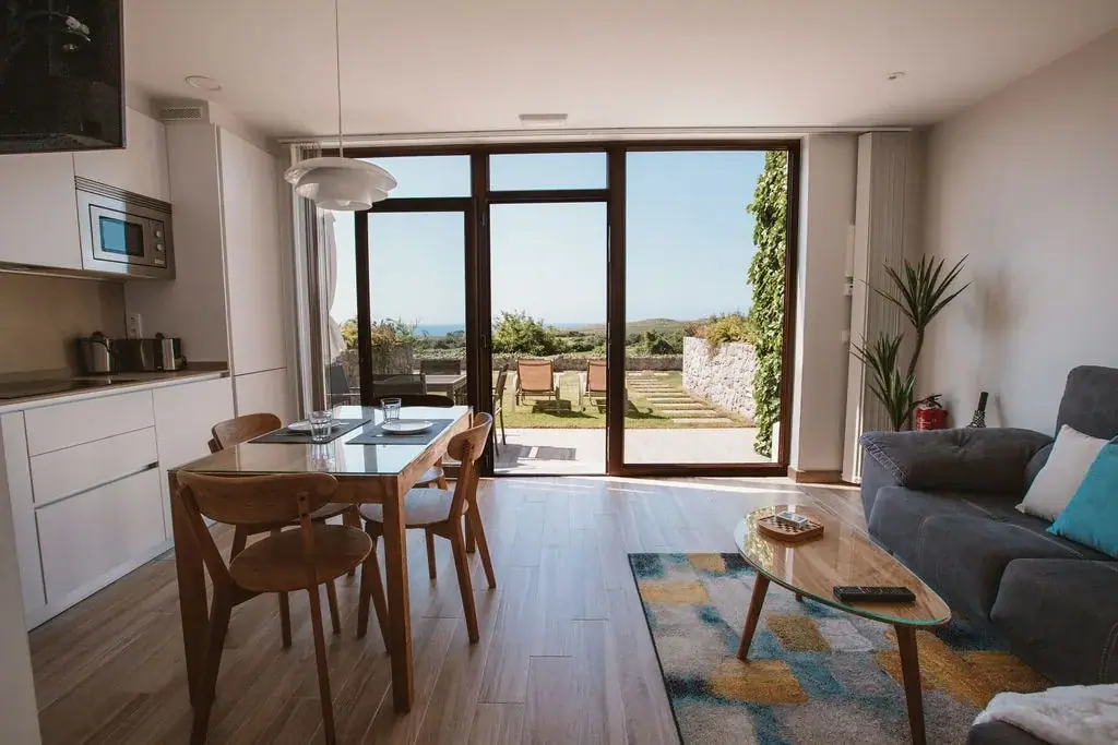 Living and dining room of a Standard apartment, opening onto the terrace