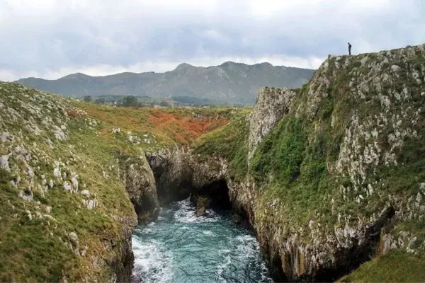 An inlet of the sea between limestone walls