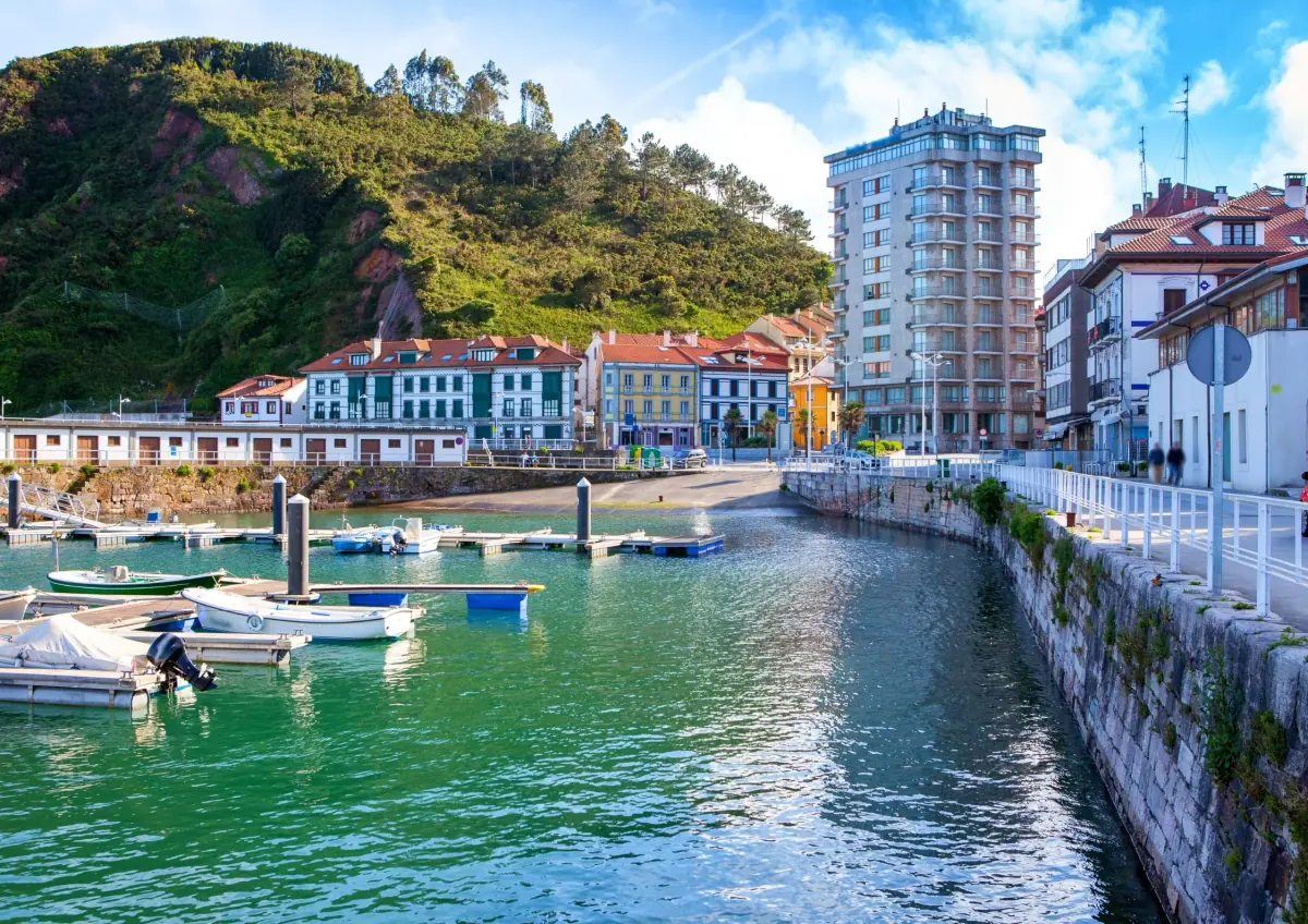 A fishing harbour with colourful houses on the Asturian coast