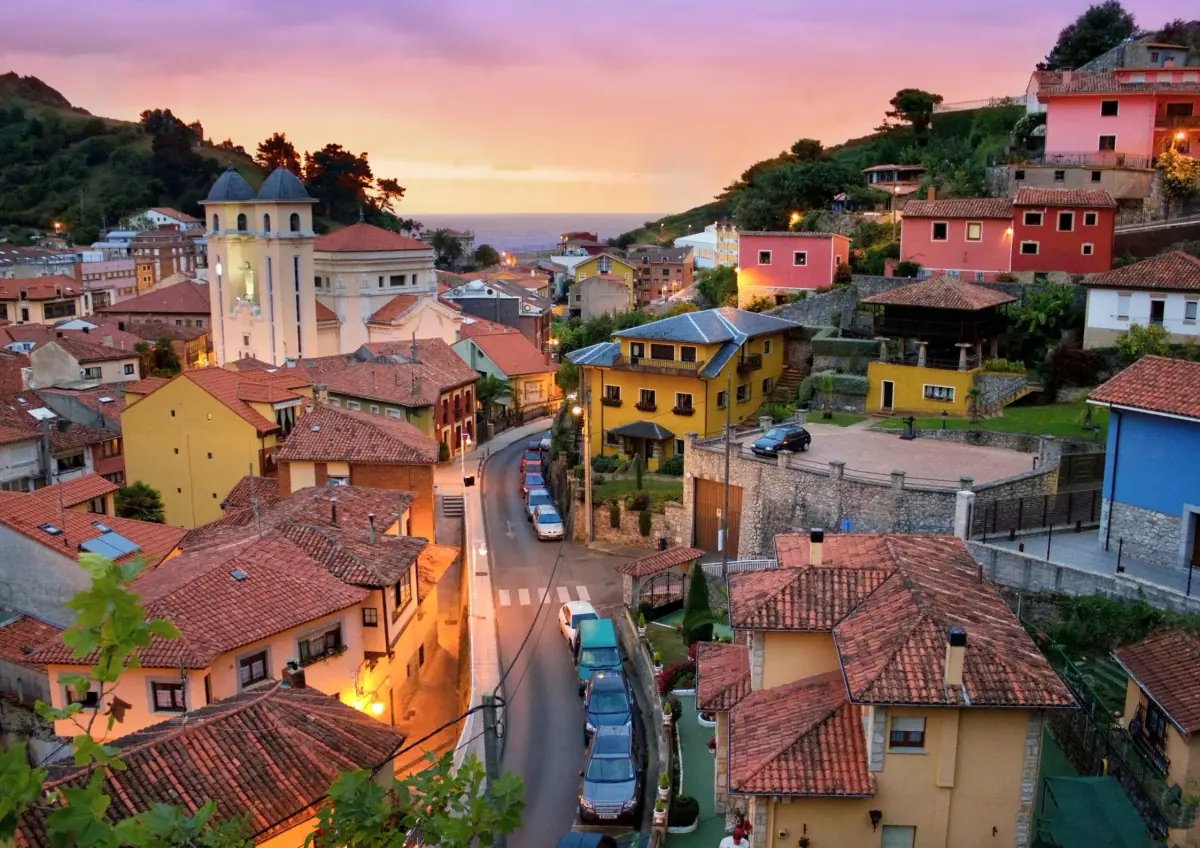 A village of colourful houses at sunset