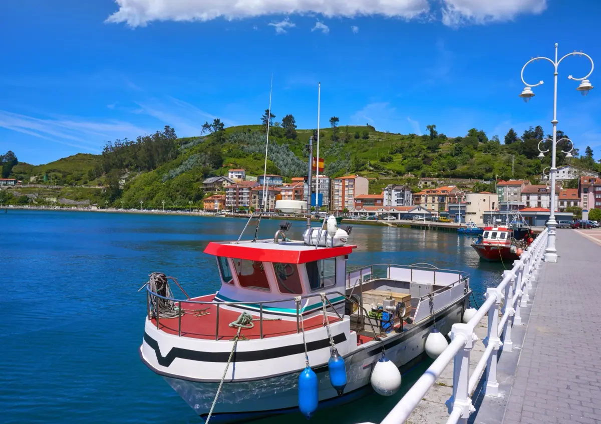 A fishing boat moored in a harbour on the eastern coast of Asturias