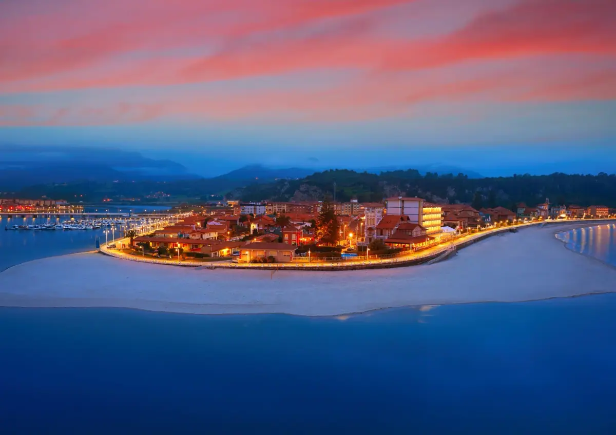 A coastal town on a peninsula at dusk