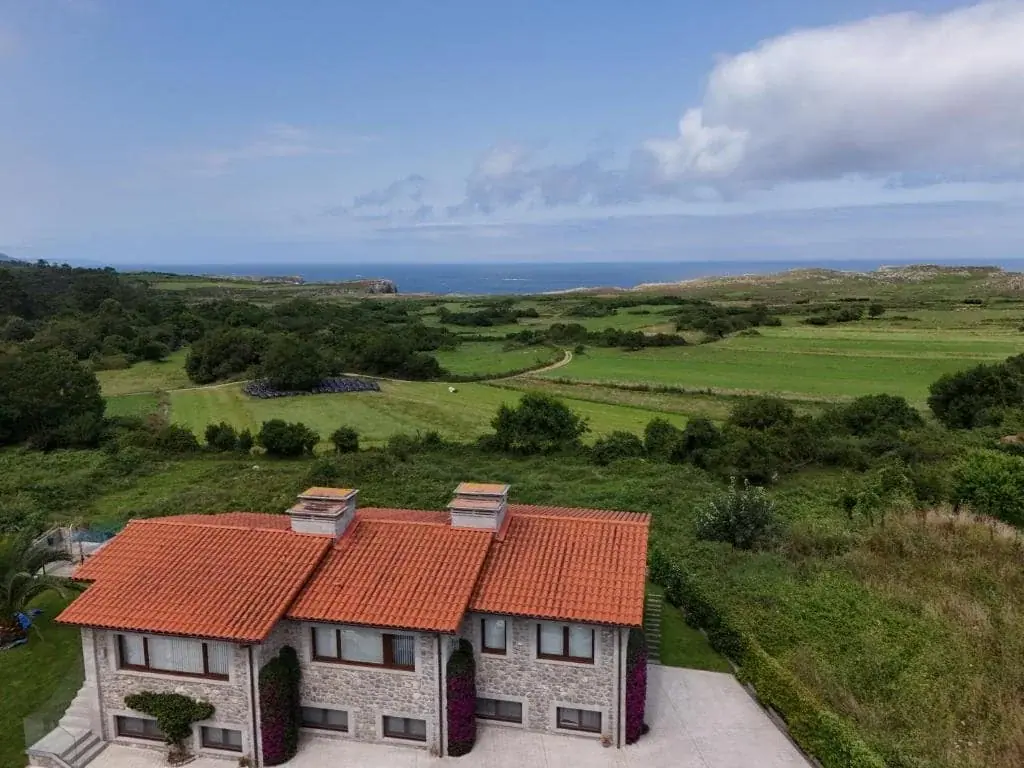 Aerial view of the Bufones de Pría apartments with the sea beyond
