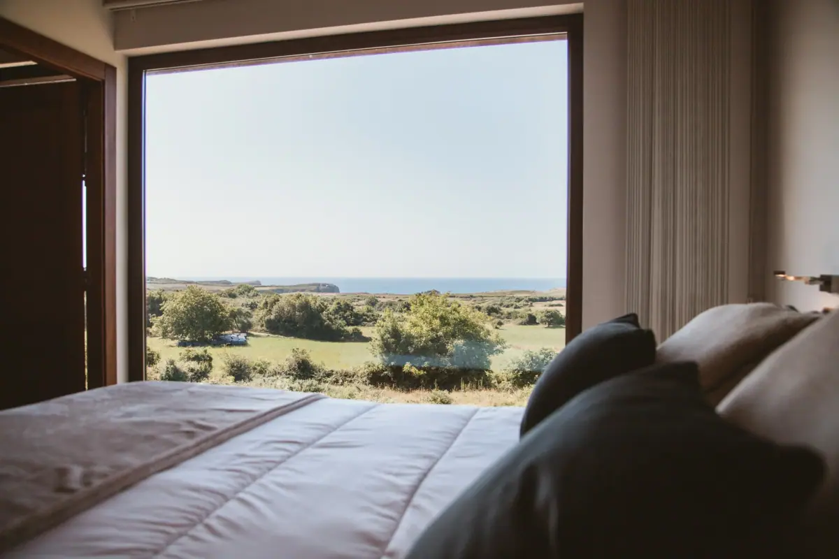 Main bedroom of the Deluxe apartment, with a picture window onto the sea