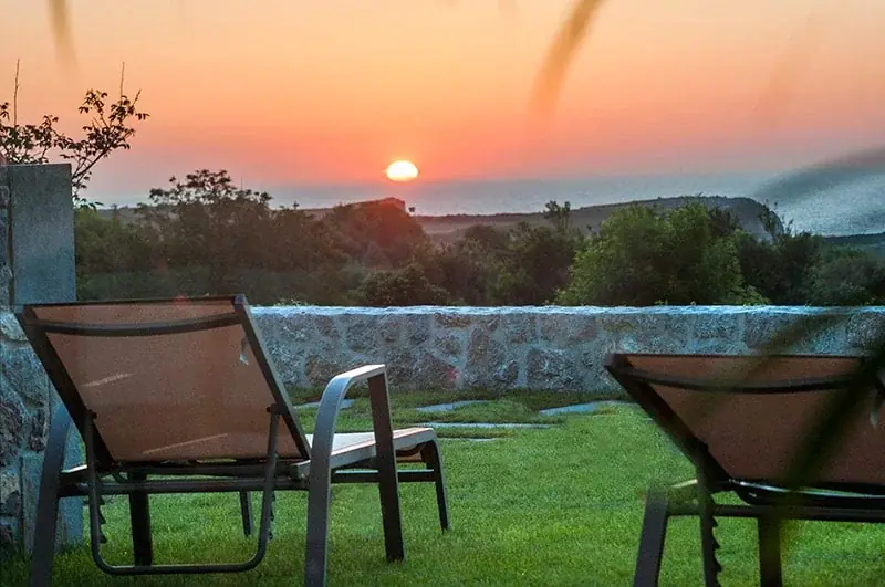 Sun loungers in the garden facing the sunset