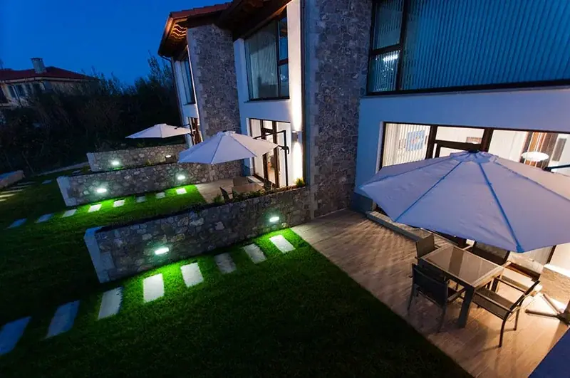 Garden and terraces lit up at dusk