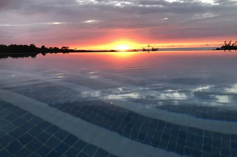 Sunset over the sea from the infinity pool