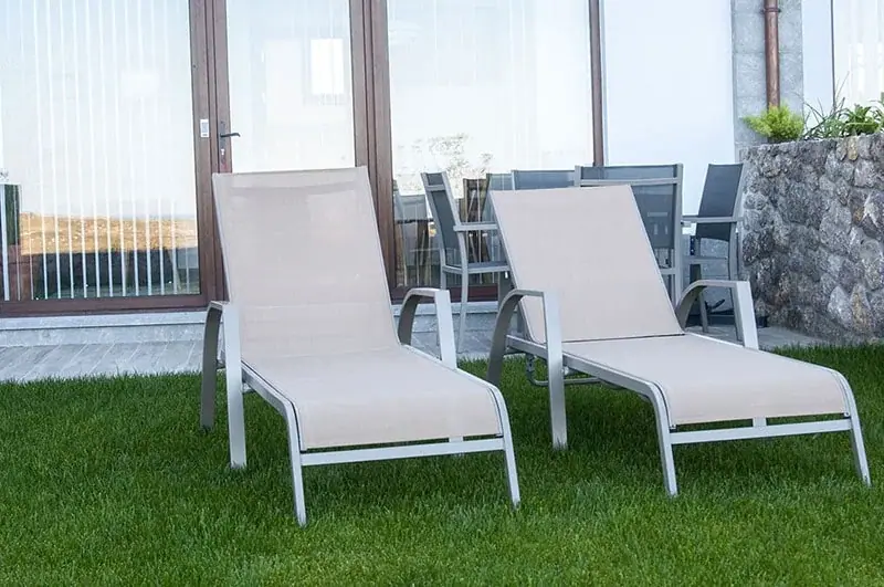 Sun loungers in the private garden of an apartment