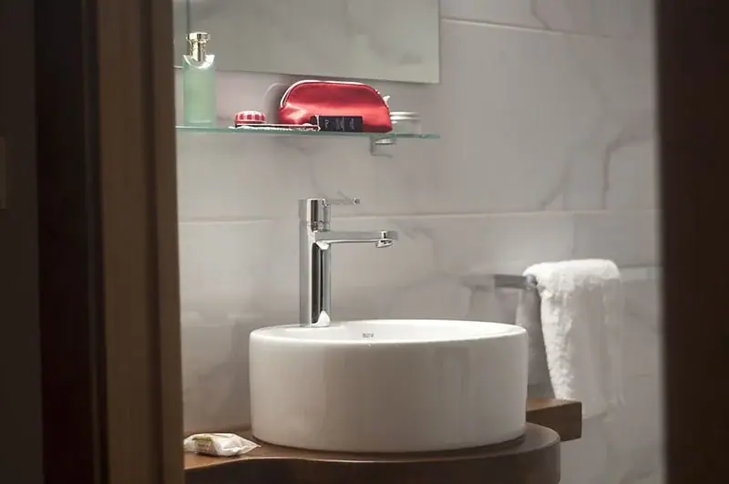 Washbasin and towels in one of the apartments' bathrooms