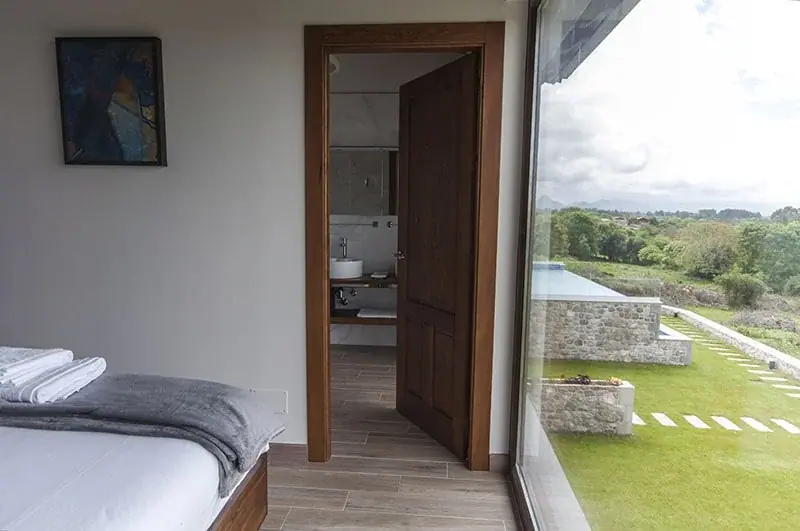 Bedroom with a wardrobe and a window in a Standard apartment
